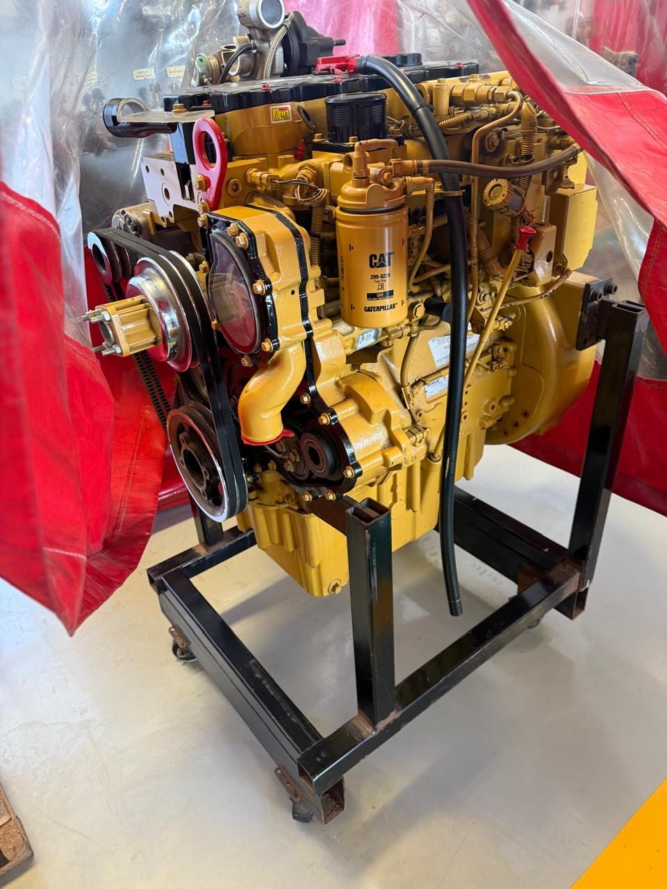Reconditioned Caterpillar engine on a stand at the Big Struqtive workshop